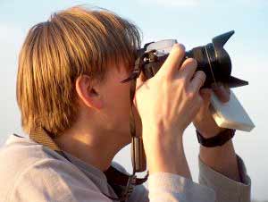 Photo of a man taking pictures with his camera